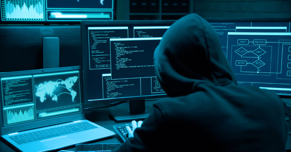 Hacker in front of a computer stealing data